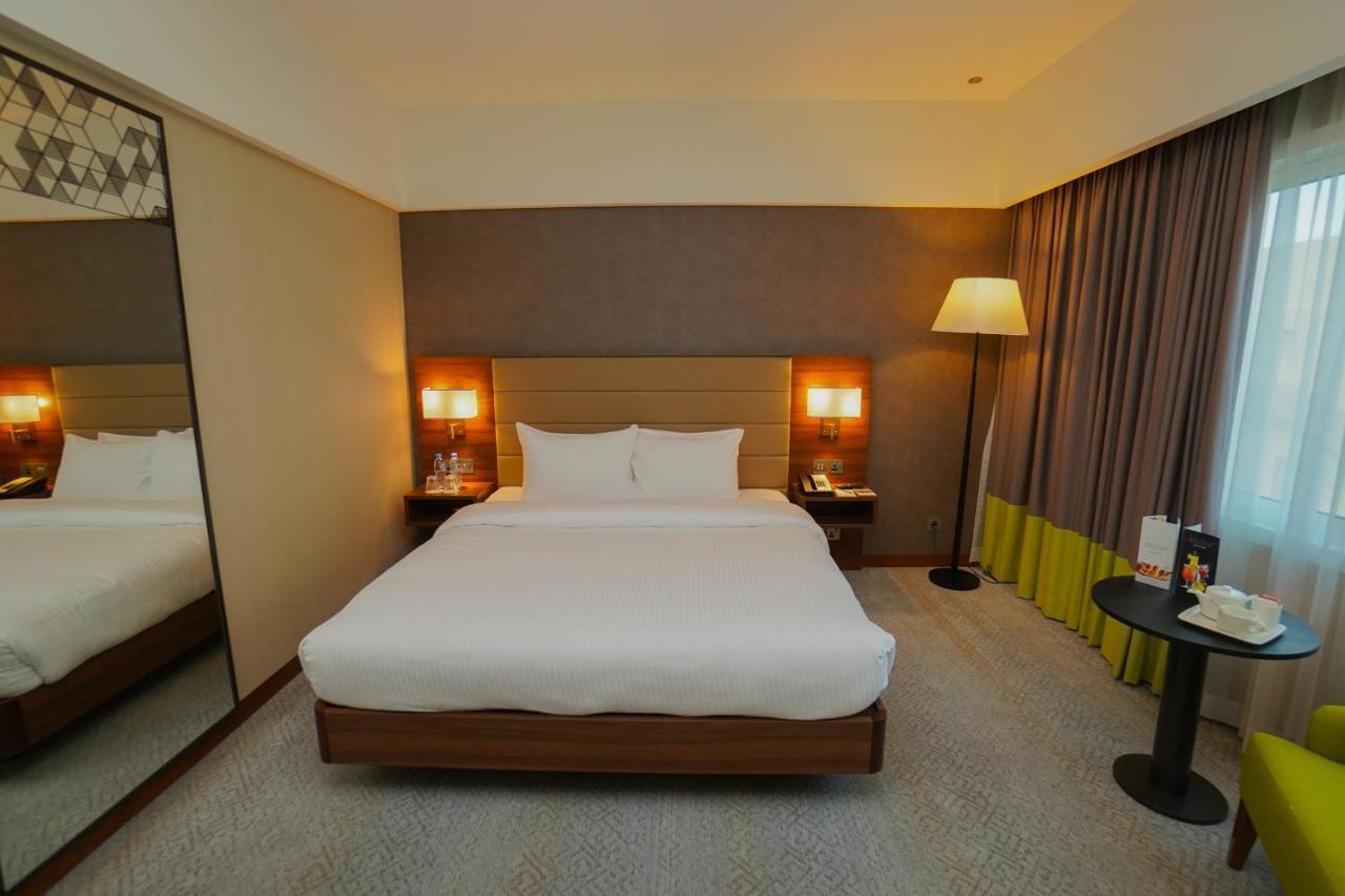The Grand Lux Hotel Doha Eksteriør bilde A room at the hotel